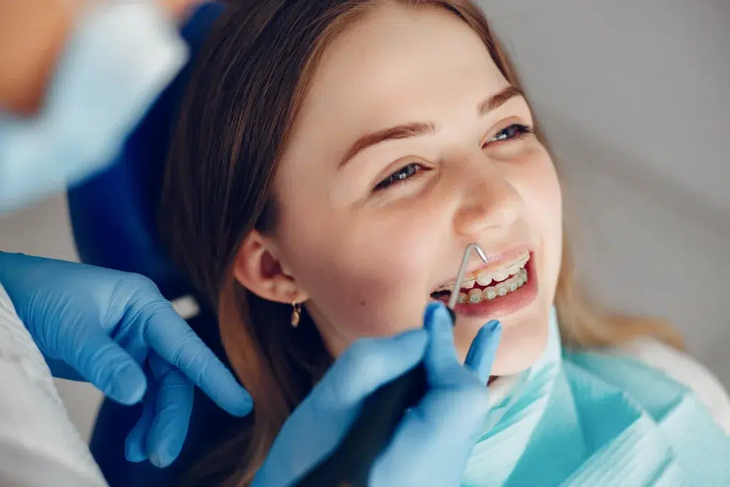 Teenage Girl Sitting In Dentist Office