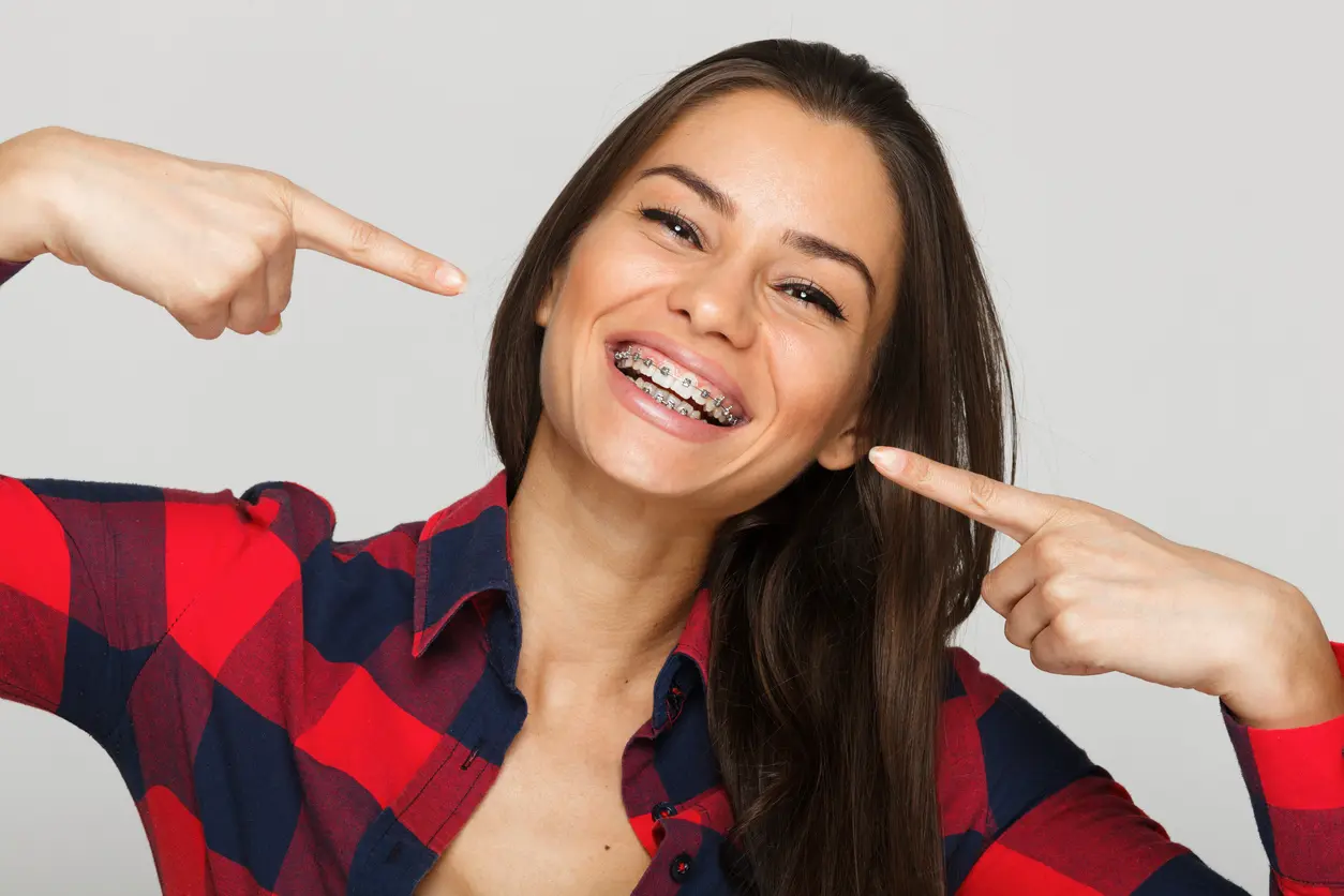 Woman showing off her braces