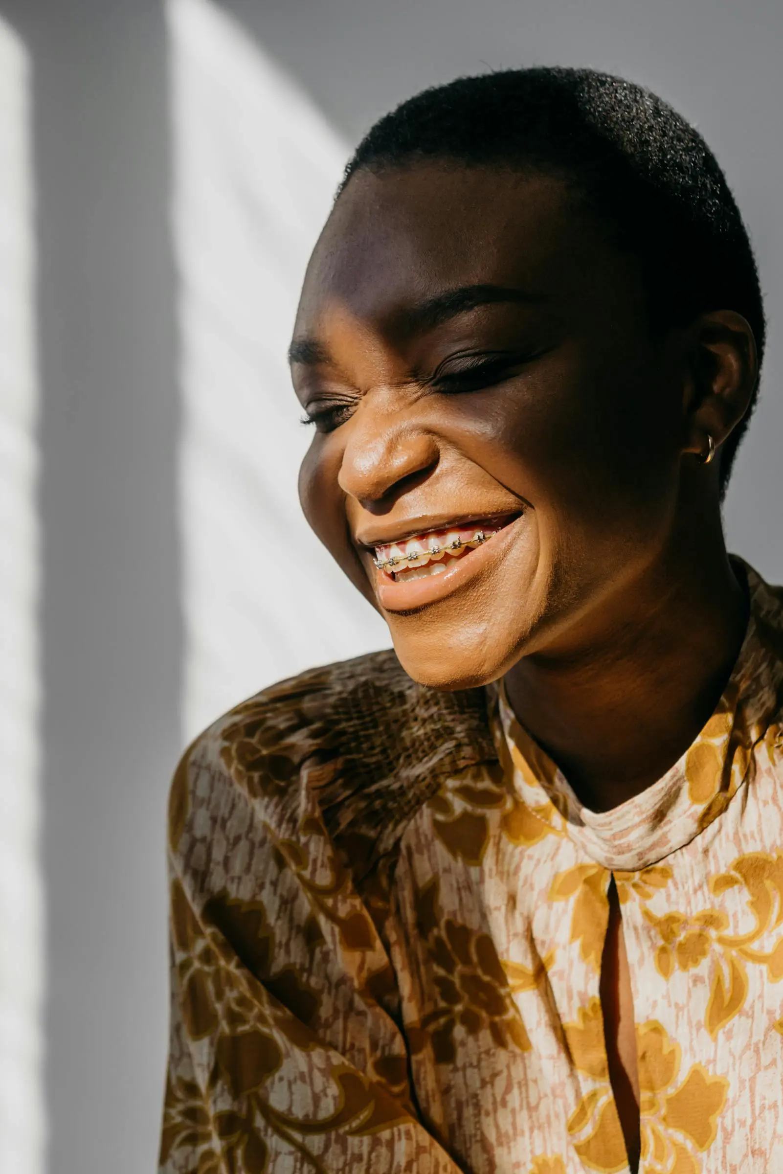 Confident woman revealing her braces with a smile