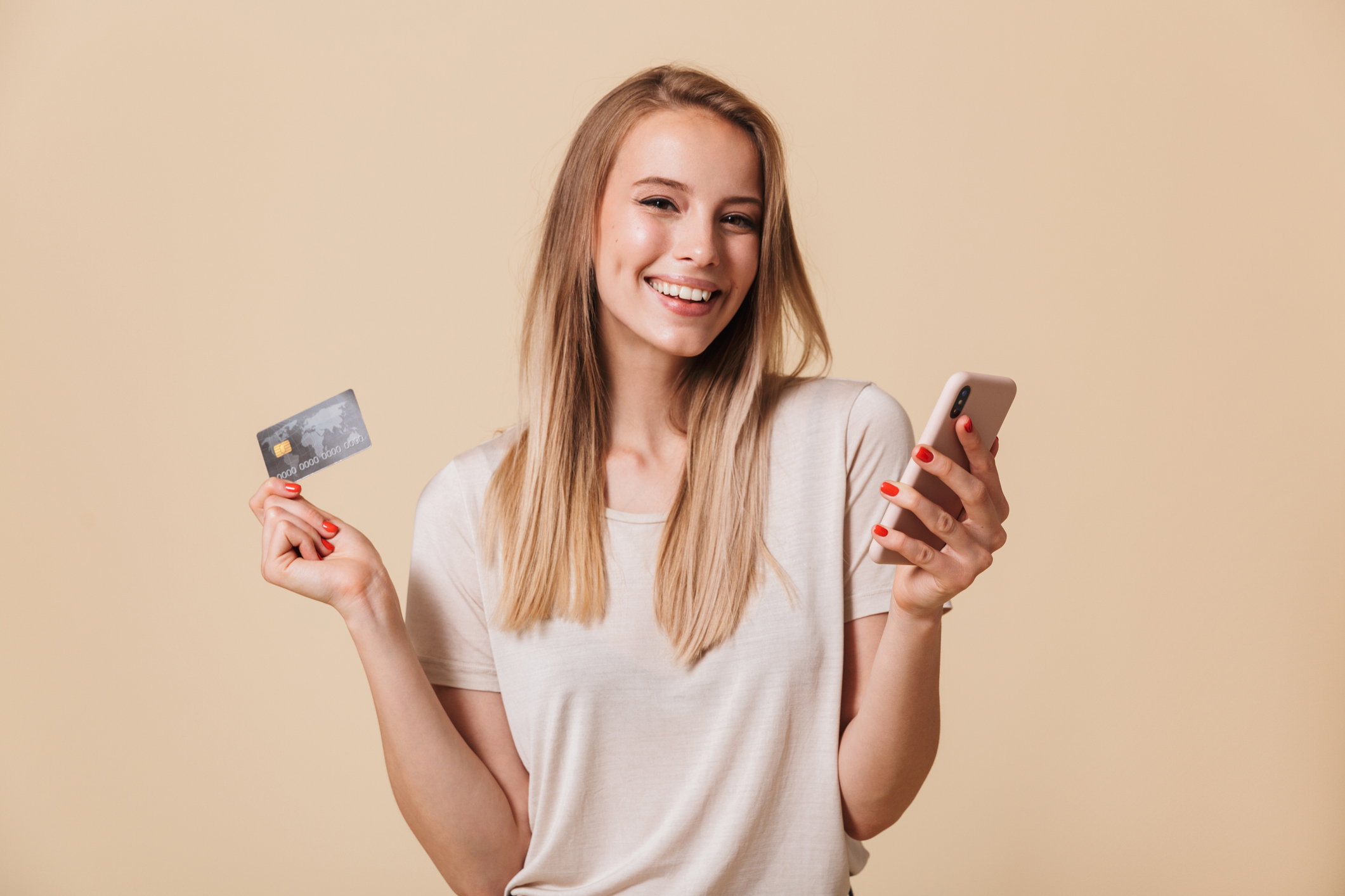 Portrait Of A Woman Holding A Phone And Credit Card